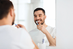 My kid hates brushing her teeth. What can I do to change that