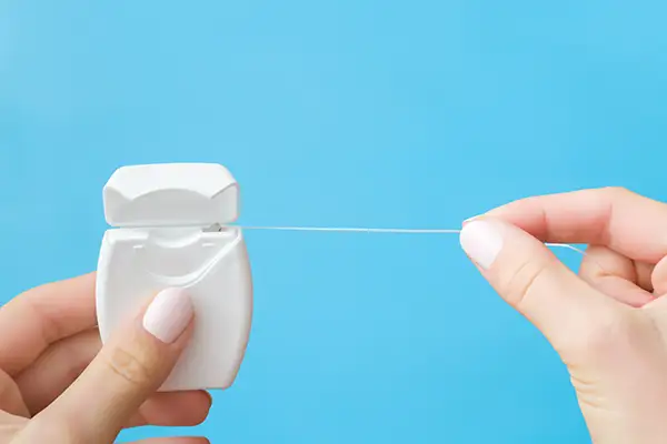 Dangers of Flossing Too Hard